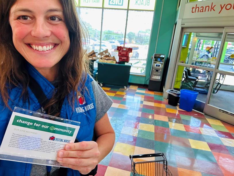 Megan, an OT with VNA, rounds up for change at The Merc Co+op.