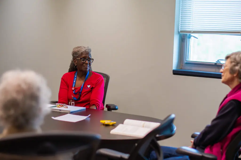 Chaplain speaking with grief group attendees