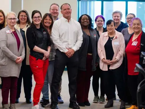 Dr. Wiles posing with members of VNA's Hospice team.