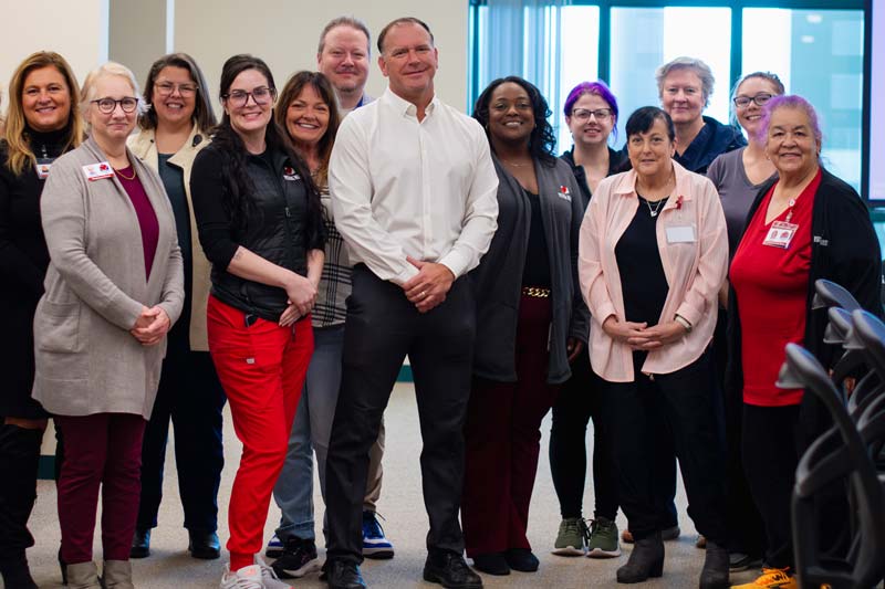 Dr. Wiles posing with members of VNA's Hospice team.